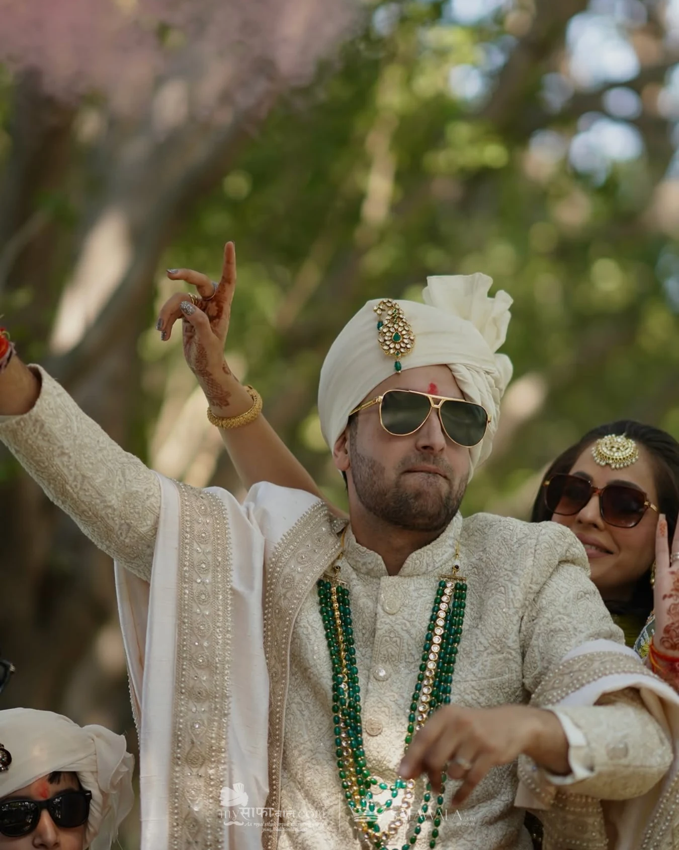 Groom in an ivory wedding safa with emerald jewellery for Lien Chieu